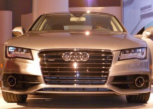 Audi kicked off the New York Auto Show by introducing the new A7, arguably the most beautiful sedan Audi has ever built, on the eve of press days for a show featuring high-mileage and inexpensive cars.