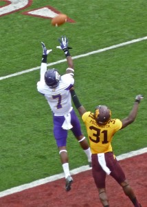 Lance Lenoir went up to catch Trent Norvell's TD pass over Gopher defender Eric Murraty for a 12-7 lead.