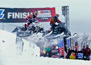There was a difference between the first and last laps of the AMSOIL SnoCross feature at Duluth's Spirit Mountain. On the first lap, left, Tucker Hibbert made a flying pass of early leader Kyle Palliln; on the last lap, Hibbert was alone with the checkered flag.
