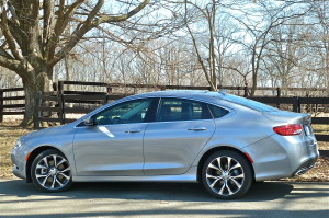 Four-door-coupe shape gives 200 class beyond what its $22,000 sticker implies.